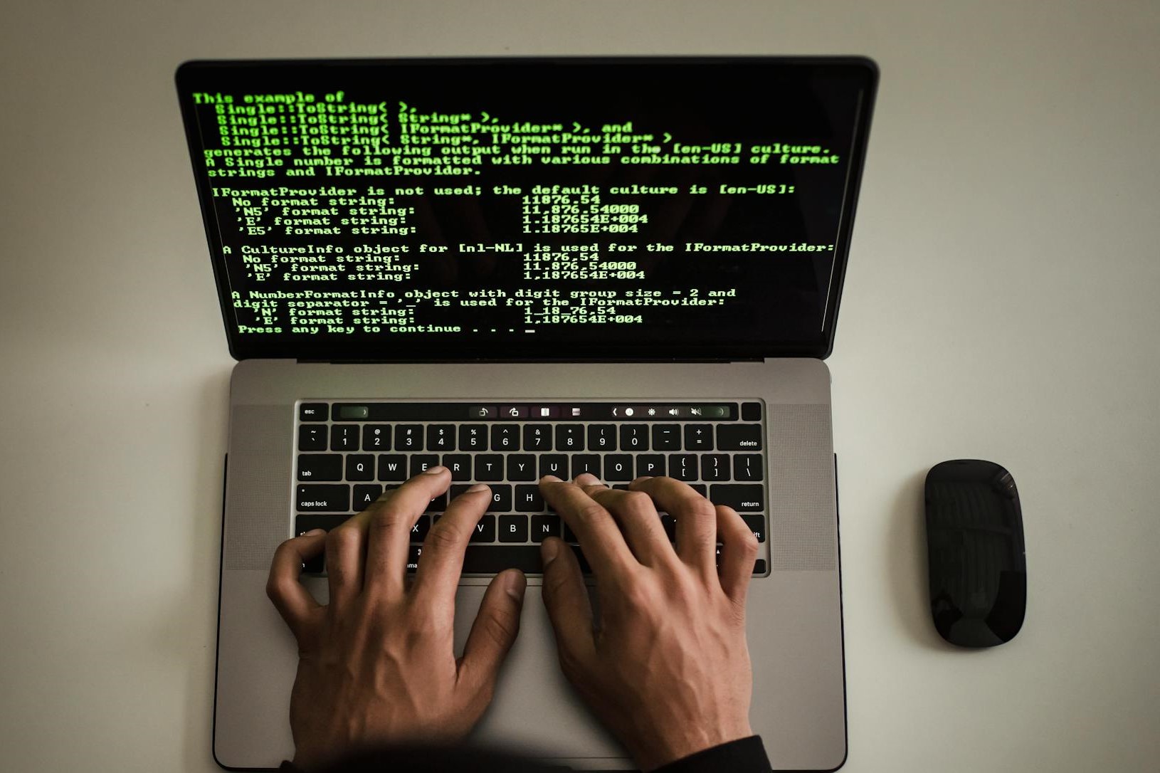 Someone is coding on a laptop